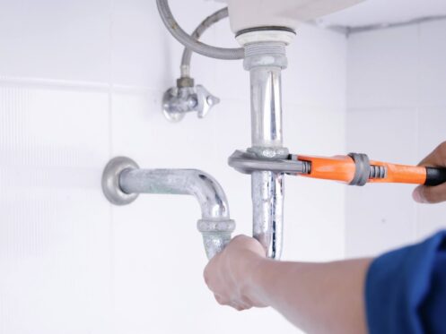 plumber-fixing-sink